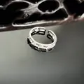 Detailed macro shot of an elegant silver snake-shaped ring with micro-inlaid stones - Simple Segmented Snake Style (14号)