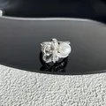 Detailed view of silver bow ring with shimmering crystals and a large white pearl - Style 2