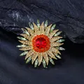 Detailed view of luxury sunflower brooch featuring vibrant red crystals and green accents - Red Green Sunflower Style (XD825065) / Gold and Red Green