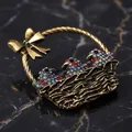 Vintage antique gold bird basket brooch decorated with vibrant colorful rhinestones - Bird Basket / Antique Gold