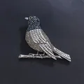 Detailed close-up of a vintage robin bird brooch with sparkling rhinestones. - Heavy Robin Pave (XD824314-2)