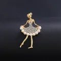 Detailed close-up of a gold ballerina brooch featuring sparkling rhinestones and pearls. - Style (XD824155-2) / KC Gold, White Rhinestone And Beige Artificial Pearl