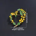 Detailed view of heart-shaped mimosa floral brooch with dimensions and weight info - Yellow Heart