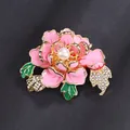 Vintage pink enamel peony flower brooch with a central pearl and rhinestone leaves. - Pink