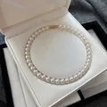 Detailed macro shot of elegant white pearl necklace with gold clasp in jewelry box - Pearl Necklace (RF479) / 10mm / Gold