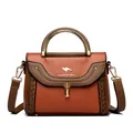 Sophisticated orange and brown leather crossbody bag with woven details and a sturdy metal handle - Yellow