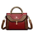 Elegant red and brown color-block crossbody bag with gold handle and woven details - Red
