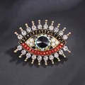 Elegant evil eye brooch with crystals and black stone for suit lapels, gold finish. - Evil Eye Style (XD824060)