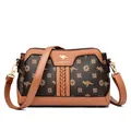 Elegant brown floral print crossbody bag with kangaroo logo and gold hardware detail - Petal Pattern & Yellow