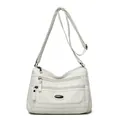 Large white washed leather crossbody bag with multiple zippers and adjustable strap - White