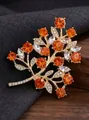 Elegant gold fruit tree brooch with vibrant orange crystals and sparkling white rhinestones - KC Gold, Orange-Red Fruit Tree