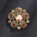 Elegant vintage alloy flower brooch featuring a central faux pearl and red rhinestones inlay - Vintage Floral Style (XD824142)