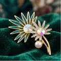 Elegant dual flower brooch with teal enamel, crystals and pearl on green velvet background. - Teal Drip Glaze Pave Rhinestone Double Sunflower Style (823362)