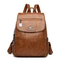 Elegant brown faux sheepskin leather backpack for women with kangaroo logo detail and zipper - Brown