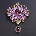 Large vintage brooch with purple glass crystals and gold-tone alloy setting. - Purple