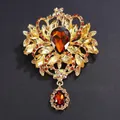 Exquisite vintage large golden alloy brooch featuring amber glass stones and rhinestones - Coffee