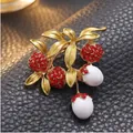 Elegant sweet lychee fruit brooch with red crystals and white beads on golden leaves. - KC Gold Red Diamond Lychee Style