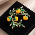 Elegant enamel persimmon brooch pin on black velvet, autumn fruit fashion accessory - Green Leaf Orange Fruit Persimmon Style (824072)