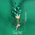 Elegant rose brooch with green K9 glass and 14K gold plating, shown with dimensions - 14k Gold Rose Brooch
