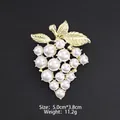Elegant grape-shaped brooch featuring gold alloy leaves and white pearls on black - Matte Gold Grape