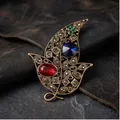 Vintage hollow leaf brooch with colorful crystals on leather background - Bronze Hollow Blue Main Stone Red Green Rhinestone Leaf Style (823324)