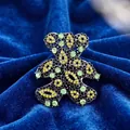 Vintage hollow teddy bear brooch with green and yellow rhinestones on blue velvet - Sitting Hollow Teddy Bear / Antique Silver Base/Yellow Green Rhinestone