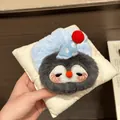 Detailed view of a plush penguin cartoon hair scrunchie with soft faux fur texture. - Penguin Plush Toy / About 9cm