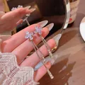 Elegant silver tassel earrings with zircon flower studs for a sophisticated Korean look - Cross Floral Tassel Style (E6785)