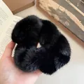 Elegant large black fuzzy scrunchie with soft faux fur texture for winter hair styling. - Black Plush