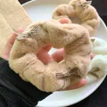 Fluffy plush hair scrunchie with checkered bow in khaki for winter hair styling - Small Coffee Bow