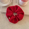 Large red ribbed knitted scrunchie for winter bun hairstyles - Bright Red Ribbed