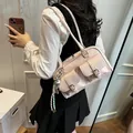 Fashionable pink patent leather underarm shoulder bag featuring trendy double front pockets - Style With Charm (FM8513) / Pink