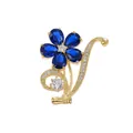 Elegant gardenia flower brooch with vibrant blue crystals in a polished gold-toned finish - Floral Style (TXZ143) / Champagne Gold Blue