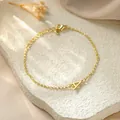 Elegant gold stainless steel chain bracelet featuring a dainty letter A pendant detail. - Letter A Style / Gold