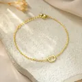 Close-up of gold-plated stainless steel chain bracelet with a capital letter D charm - Letter D Style / Gold