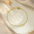 Detailed view of gold-plated stainless steel chain bracelet with letter F pendant - Letter F Style / Gold