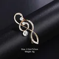 Elegant gold-tone musical treble clef brooch pin with sparkling white crystal rhinestones. - Music Note Style (XD9114) / 2.3x5.5cm / Gold