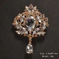 Elegant vintage teardrop crystal brooch with gold-tone finish and hanging pendant - Gold Style (XD145-2)