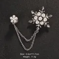Elegant silver-tone snowflake brooch with white pearls and double chain detail - 3.4cm*11.7cm / Silver Snowflake