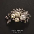 Elegant silver-toned floral brooch pin featuring four large white pearls and clear rhinestones - Hollow Leaf Petal Style (XD1323) / Size: 3.9x6.3cm / Silver