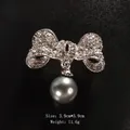Elegant silver bow brooch with crystal rhinestones and a dangling round grey pearl accent - Pave Rhinestone Bowknot With Grey Pearl (XD10915-2) / 3.9x3.9cm / Bowknot Pendant Grey Pearl (Silver)