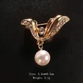 Elegant gold-tone bow brooch featuring sparkling crystals and a dangling white pearl charm - Wing Style Rhinestone Pendant Pearl (XD9367-1) / 3.2x3.3cm / Wing Bowknot Pendant Pearl (Gold)