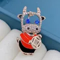 Detailed SKU view of a rose gold cartoon ox brooch featuring vibrant blue crystal eyes - Cartoon Lucky Cow Style (XD9498-1)