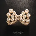 Elegant gold-tone bow brooch featuring white pearls and crystal rhinestones - Vintage Alloy With Pearl Rhinestone (XD7667) / 2.8x4.0cm / Vintage Bowknot Multi-Pearl (Gold)