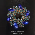 Elegant wreath brooch with blue marquise crystals and teal rhinestones on gold alloy. - 5.1x5.1cm / Gold Lake Blue