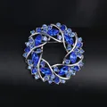 Elegant blue crystal wreath brooch in silver alloy for women's fashion accessory - White K Blue