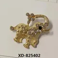 Macro view of a golden elephant brooch adorned with sparkling white rhinestone crystals - Elephant Style (XD825402) / Gold
