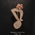 Elegant musical note brooch with sparkling rhinestones and crystal flower top in gold - Gold/Champagne Flower