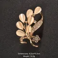 Elegant cat's eye stone brooch with sparkling rhinestones in teardrop floral design - Flower Cluster Shape (XD9160)