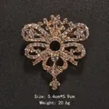 Vintage gold-toned crystal wing brooch with large sparkling rhinestones for coats - Cross Star British Wing Style (XD9066) / Verdant